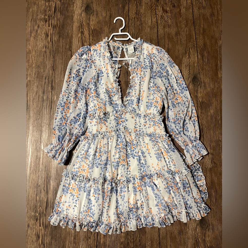 Floral dress with frills, never worn, size L